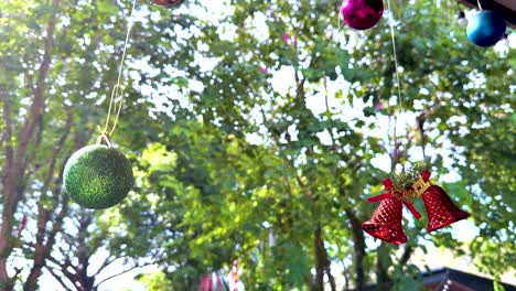 decorative bells and ornaments sway in the breeze