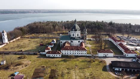 pazaislis monastery complex in aerial orbiting view of sunny day