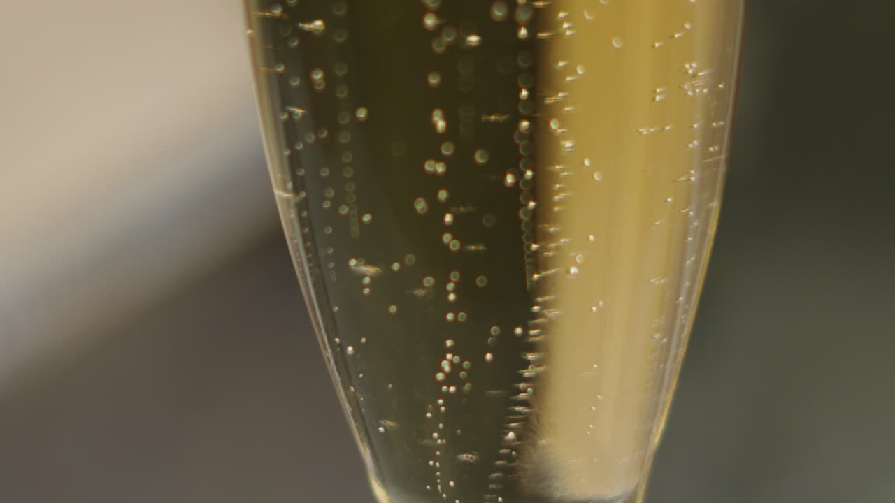 Close-up of Sparkling Champagne Bubbles in a Glass