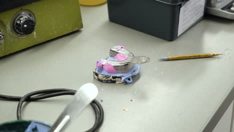 dental technician working on a dental skeletal prosthesis