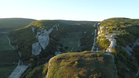 aerial view of a mountain valley with cliffs