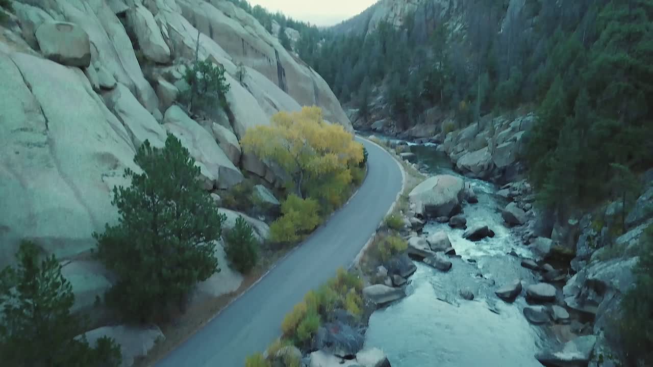 Aerial tilt to reveal otherworldly worn granite mountain landscape