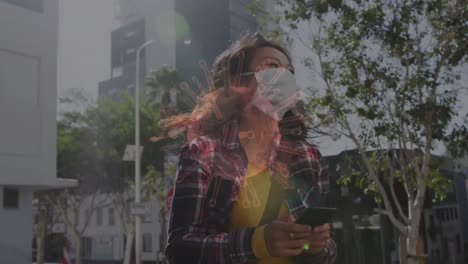 animation of covid 19 cells moving over woman in face mask