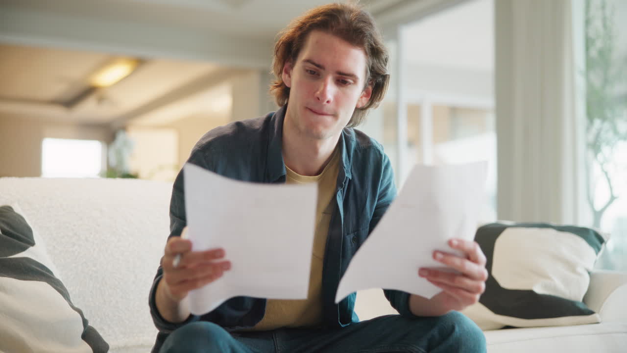 Man reviewing documents at home