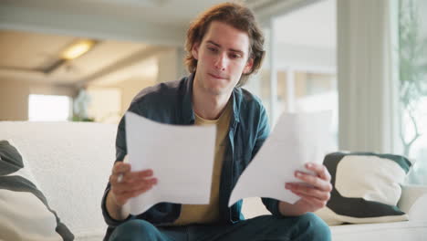 man reviewing documents at home
