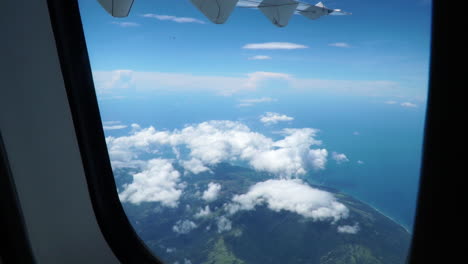 Beautiful-View-Of-Clouds-And-Mountains-From-An-Airplane-Window