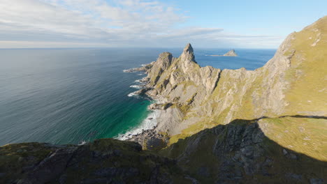 aerial reveal of måtinden mountains, vesterålen islands in norway, impressive cinematic fpv drone close-flight