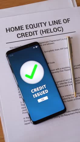 heloc loan approved. concept of taking a home equity line of credit. vertical shot.