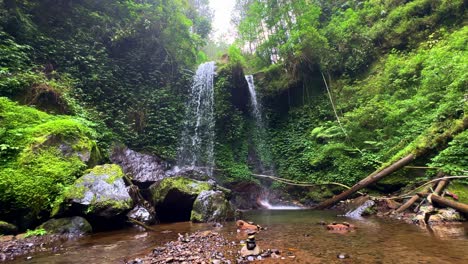 twin natural waterfall in the middle of tropical forest