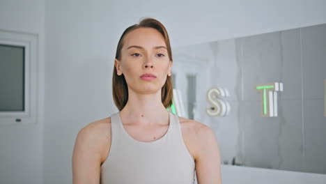 focused girl weight training indoors closeup. sport trainer dumbbells exercises