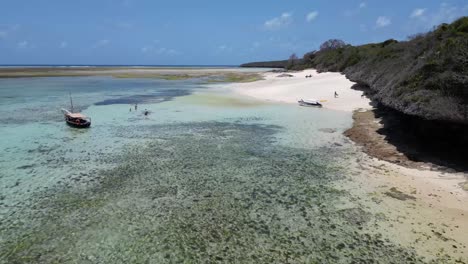 fishermen in boats at pungume island tanzania africa southern zanzibar isle, aerial low flyover shot