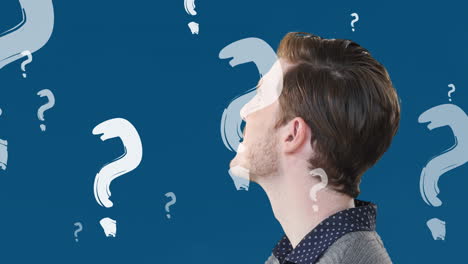 animation of question marks over caucasian man on blue background