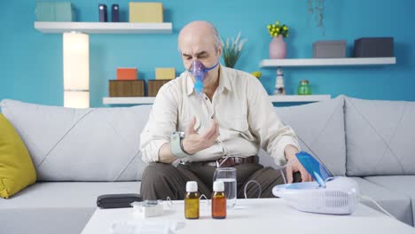 Old-man-using-respirator-measures-his-blood-pressure.