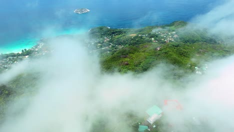 mahe seychelles , morn seychellois national park, drone over national park above clouds, the tea factory can be seen below