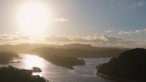 a serene sunset over a river at brunswick heads, nsw, australia, captured with warm lighting and tranquil scenery