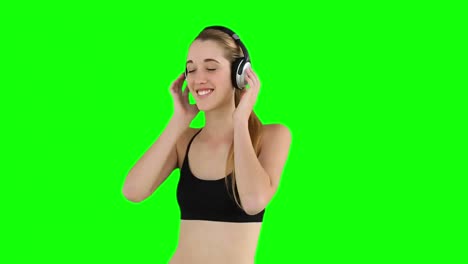 fit model listening to music and smiling