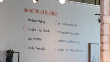 A-Large-Retail-Orange-Advertising-Wall-Board-inside-a-local-home-furniture-store-listing-the-pet-friendly-material-Benefits-of-Leather-Upholstery-home-décor-and-accessories