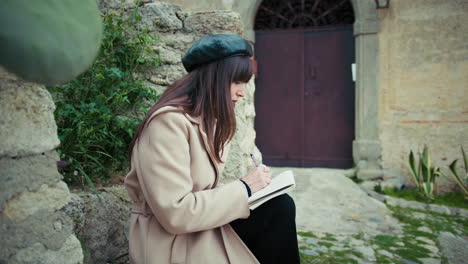 woman poet writing poems outdoor in her rural town