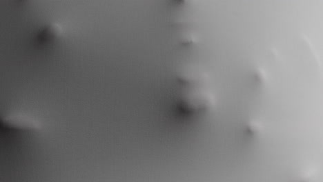 a scary face and hands appear from the white surface