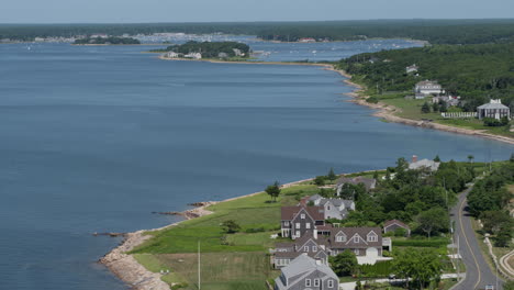 Aerial-flyover-of-houses-and-blizzard-bay-in-Plymouth,-Mass