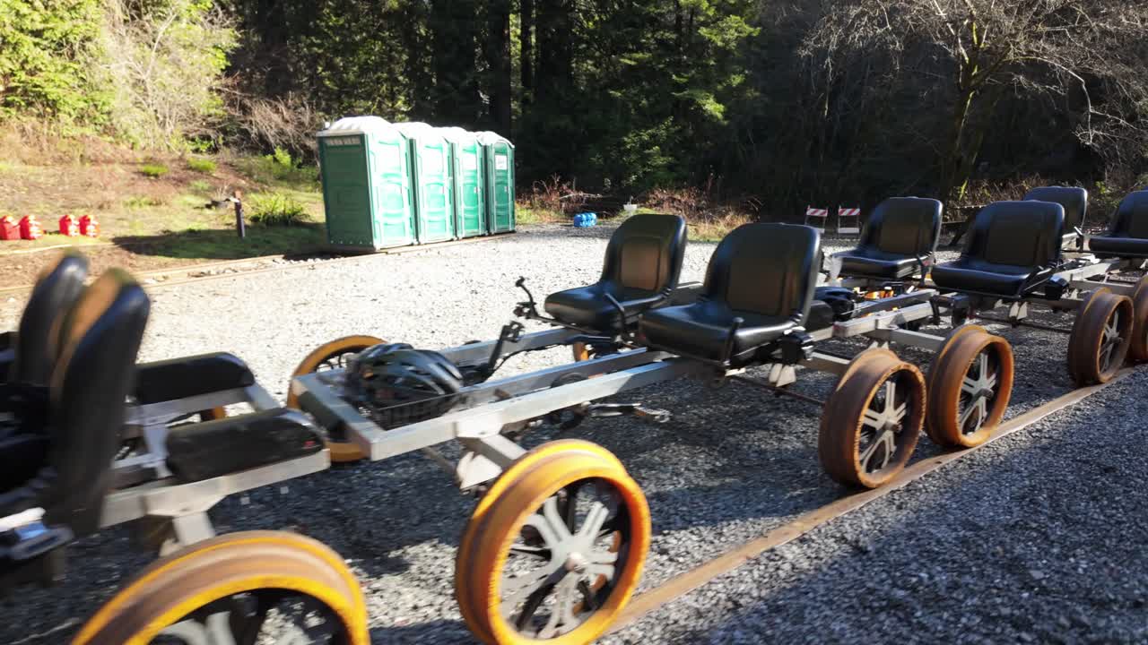Gimbal moving shot of railbikes lined up on the tracks at Glen Blair Junction in Northern California. 4K