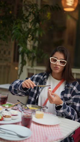 young woman enjoying turkish breakfast