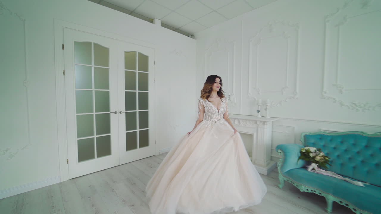 Bride posing in wedding dress. Beauty portrait of bride wearing fashion wedding dress with luxury delight makeup and hairstyle, studio indoor