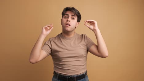 man tired of gossip gesturing with hands imitating people speaking