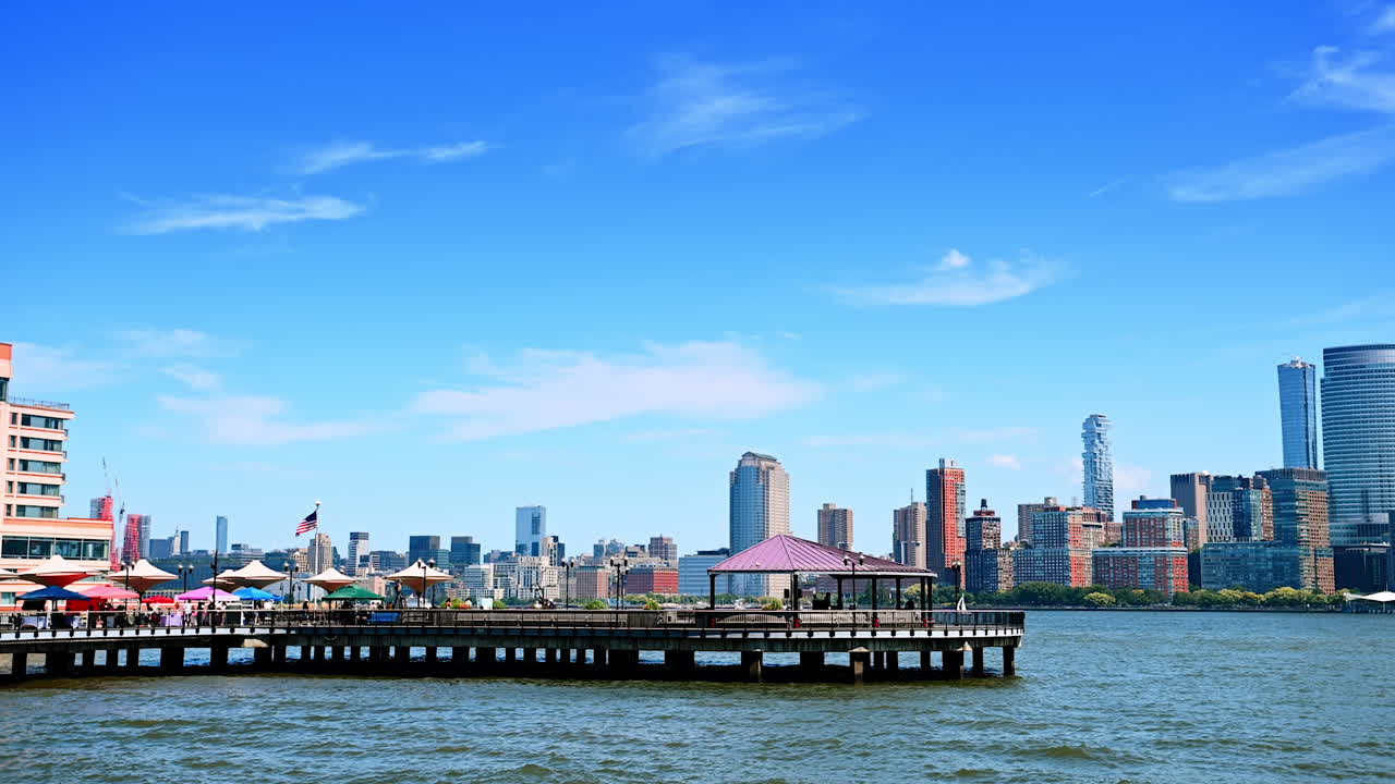 Beautiful pier on the Hudson River and skyline of gorgeous Manhattan. Watching New York from Jersey City