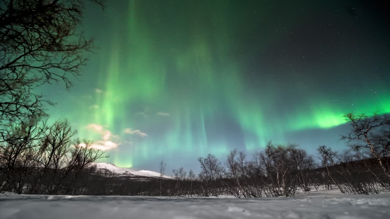 Northern lights dancing over snowy Kilpisjärvi, Finland, in a stunning timelapse
