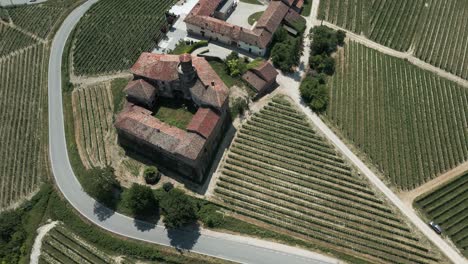 aerial view of italy's castello di la volta overlooking the town of barolo