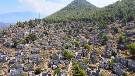 Drone-flight-close-up-over-the-ruins-of-an-ancient-fortress-located-in-the-green-mountain-hills-of-Turkey