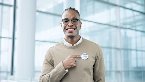 Smile,-vote-and-a-black-man-pointing-to-a-badge