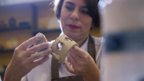 woman working on clay pottery