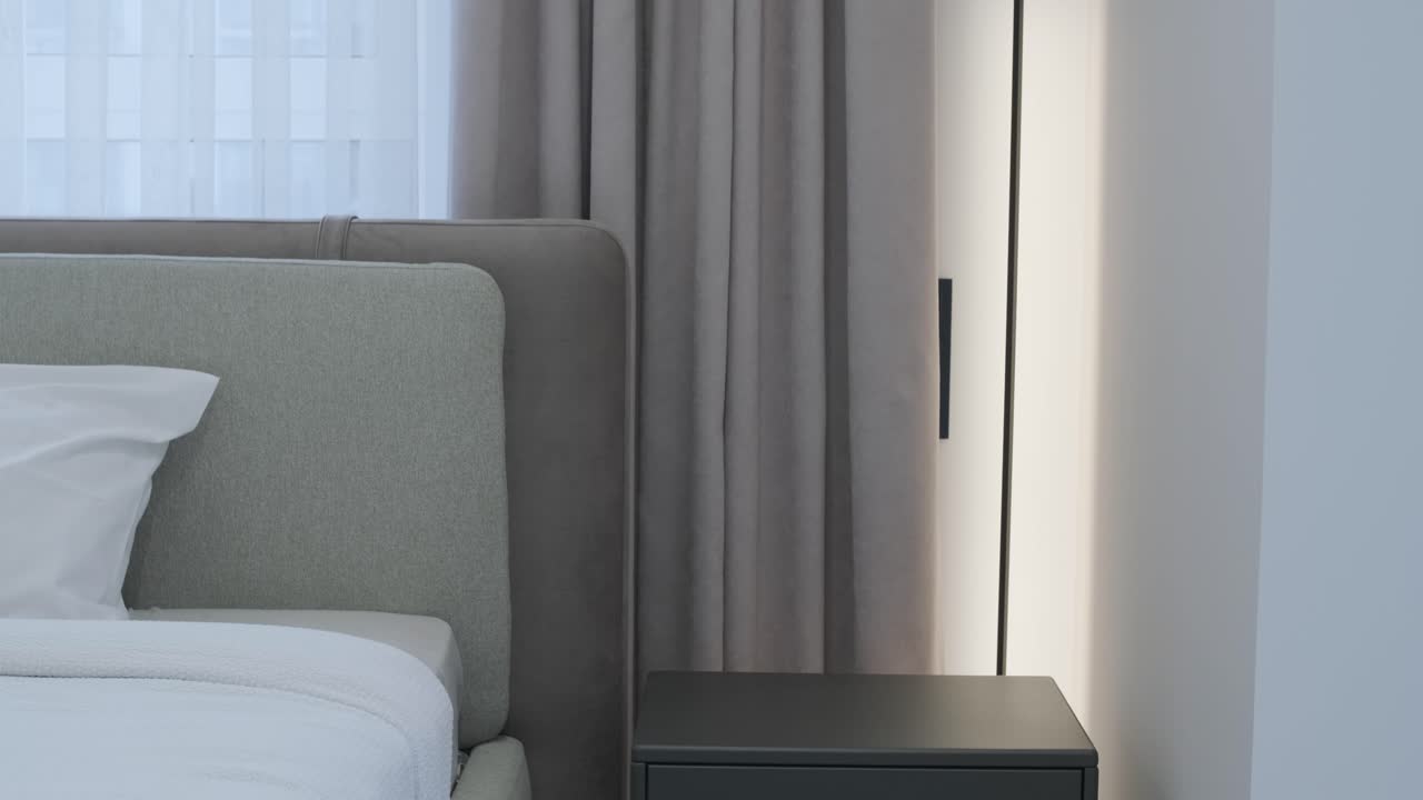 Moderne soveværelsesinteriør med seng og natbord
