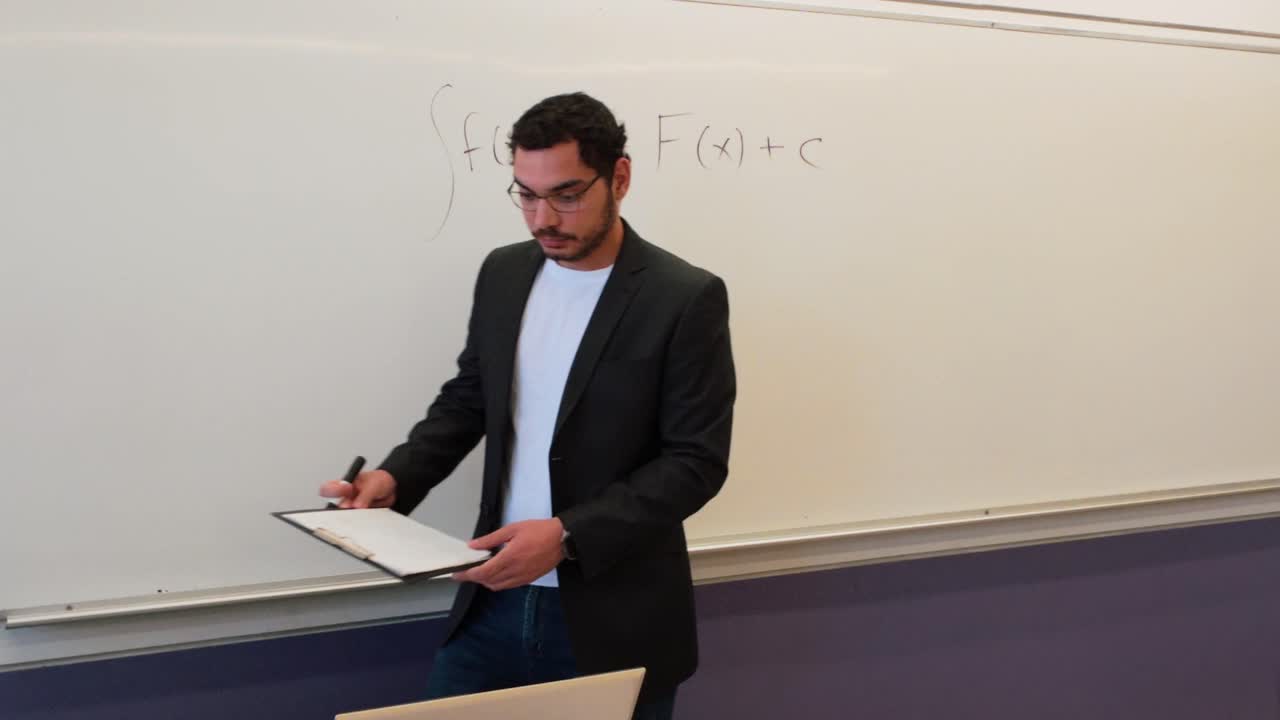 University Professor Teaching a Mathematics Lecture