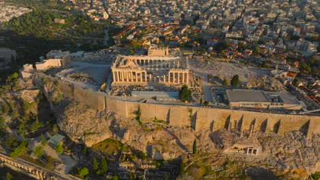 circling pan up aerial shot from the acropolis towards central athens city