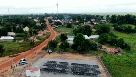 mini solar panels in the rukubi community of nigeria, west africa creating renewable energy - aerial flyover