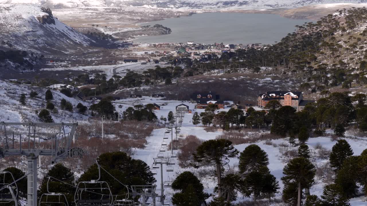 Aerial view of Caviahue ski resort chairlift and lake in Neuquén, Argentina