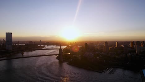 aerial view towards the sunrise above dumbo, vinegar hill and williamsburg of new york