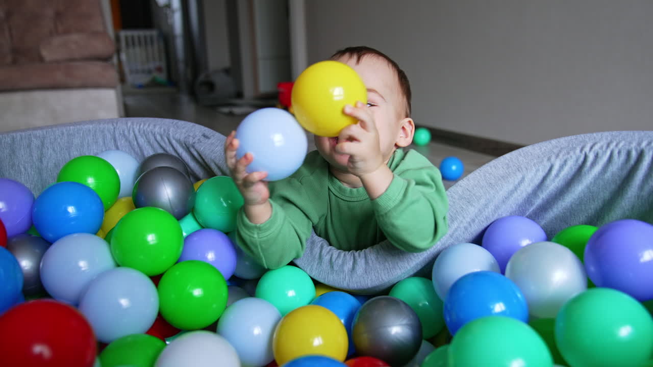 Baby Playing in a Ball Pit