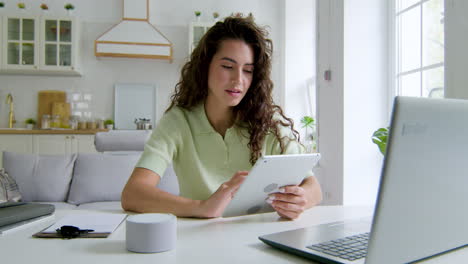 woman sitting at desk in the living room