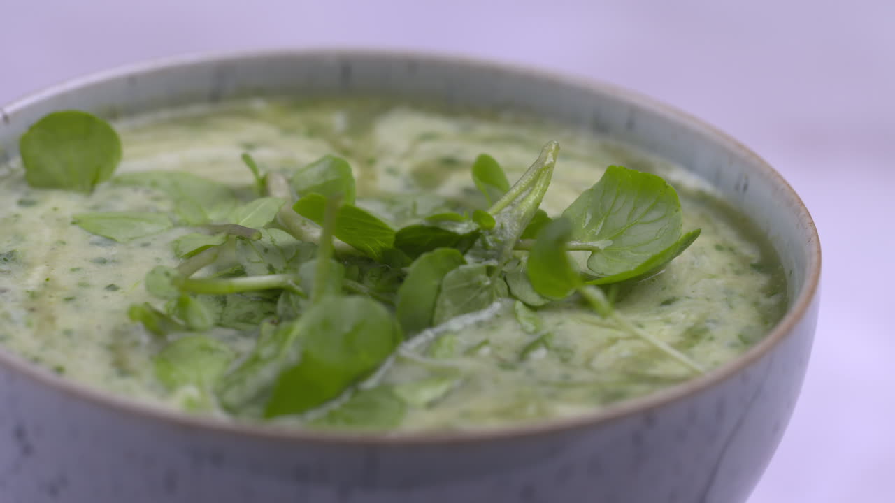 Watercress Recipe. Soup Rotating In Bowl With White Background. Healthy Lunchtime Food.Protein Plant Based Raw Vegan Food. Health And Vegetarian Foods. Healthy Ingredients. 4k Macro Food Shot