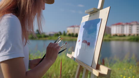 woman painting landscape outdoors