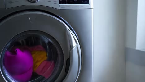 modern washing machine with clothes