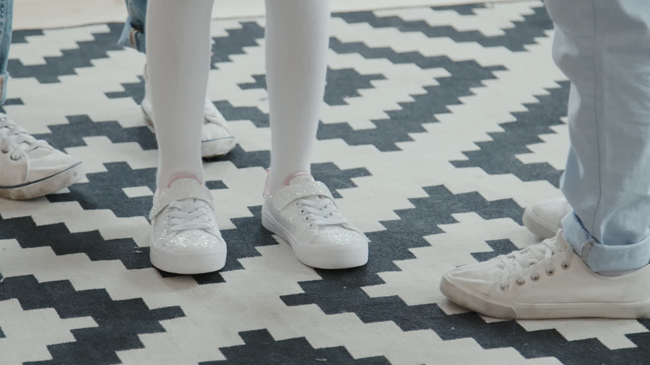 Legs of Kids Playing Game at Home