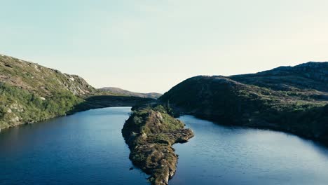 aerial above hesttjonna lake in indre fosen, norway