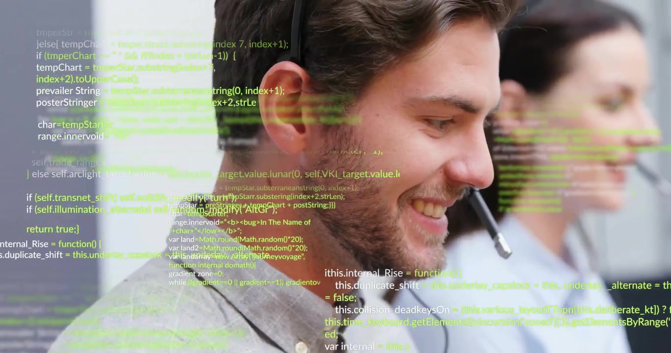 During support call male agent typing to resolve request while monitoring code overlay intensifying