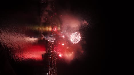 dolly in establishing of several boats launching fireworks on the shores of the city of valparaiso chile at the end of the year closing