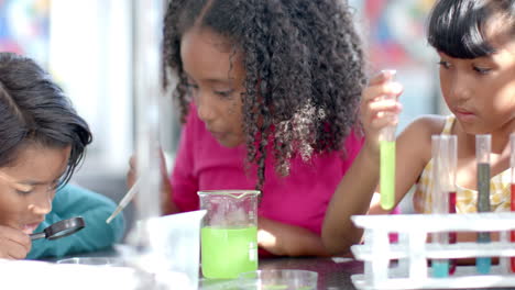 in school, a group of young students engages in a chemistry experiment in the classroom
